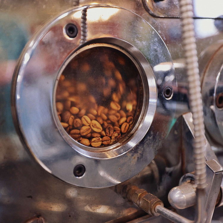 Coffee beans inside of a coffee roaster