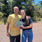 image of two happy people holding Kokua Farms chocolate bars