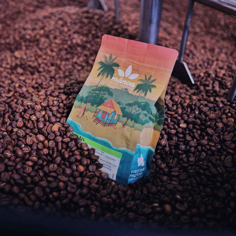 image of coffee bag in roaster bed full of beans