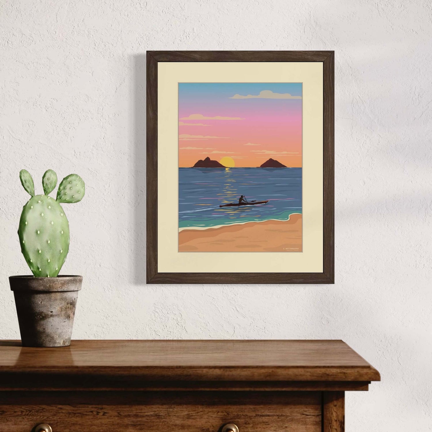 image of lanikai sunrise print hanging on a wall in a home