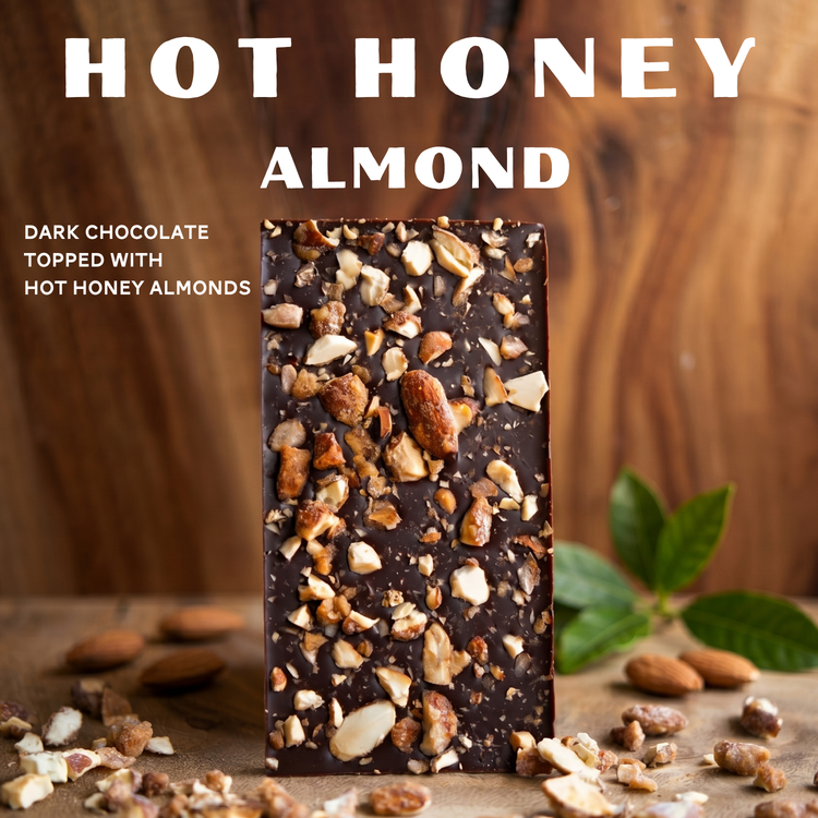 hot honey almond dark chocolate bar on a wood table