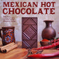 Image of Manoa chocolate bar with cinnamon, chile peppers, Mexican vases and a text overlay reading: Mexican Hot Chocolate and subtext reading: dark milk chocolat ewith cayenne pepper, cinnamon, ginger