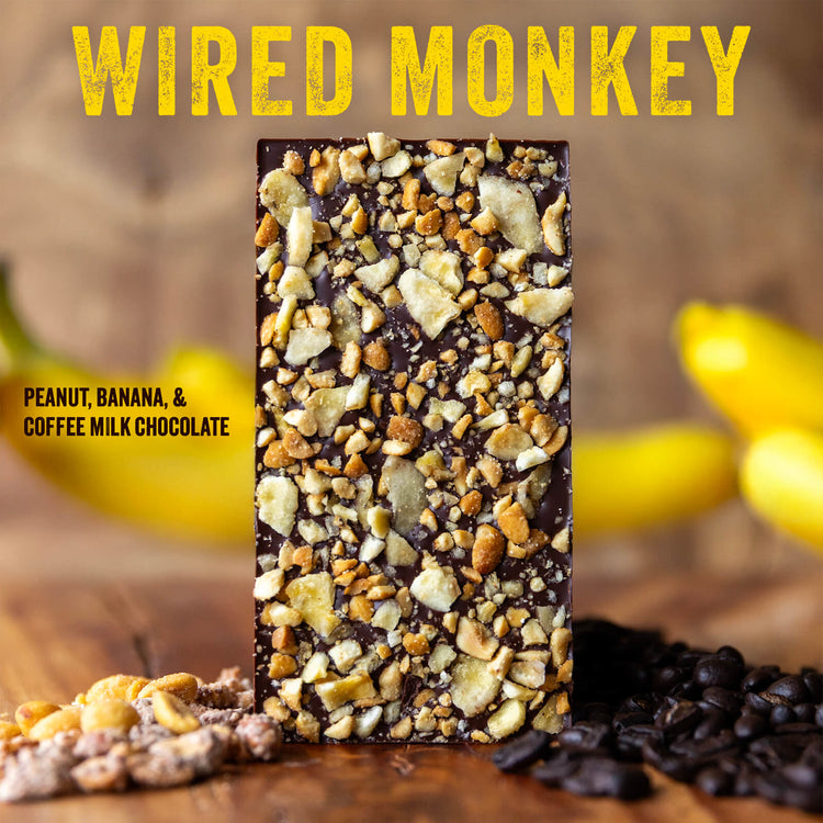 image of chocolate bar covered in banana chips and peanuts with heading "Wired Monkey" and description: "Peanut, Banana, & Chocolate Milk Chocolate