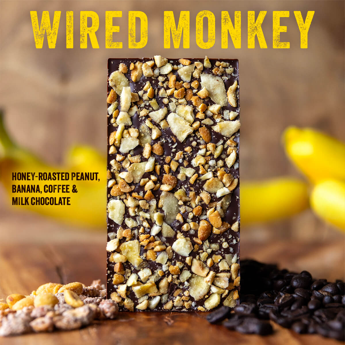 An image of a chocolate bar sprinkled with banana and peanuts with heading "Wired Monkey" and description text reading "Honey-Roasted Peanut, Banana, Coffee & Milk Chocolate
