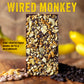 An image of a chocolate bar sprinkled with banana and peanuts with heading "Wired Monkey" and description text reading "Honey-Roasted Peanut, Banana, Coffee & Milk Chocolate