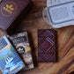image of Manoa chocolate bars on a wooden surface