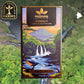 Image of honolii chocolate bar package placed over a waterfall background. Manoa Chocolate Farms logo in top left corner and Hawaiian islands chain in top right