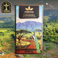 Image of Kamananui 70% dark chocolate package, featuring mountains, orchards, and a peacock