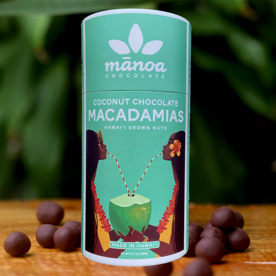 Image of brightly-colored, turquoise tube that says Coconut Chocolate Macadamias. Made in Hawaii with Hawaii grown nuts