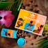 image of macadamia gift box on table with flowers and plants