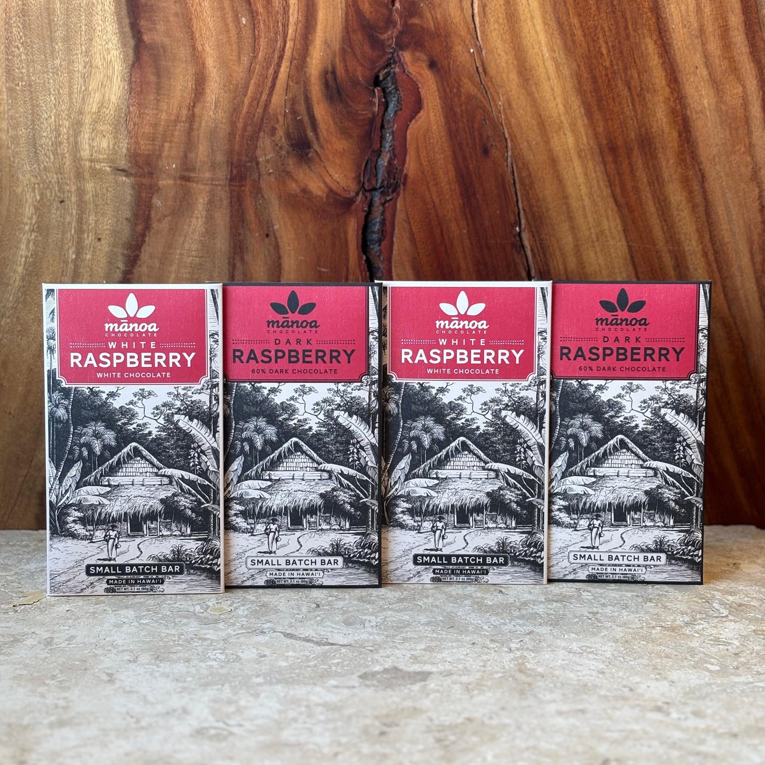 Image of 2 dark chocolate raspberry bar packages and 2 white chocolate raspberry bar packages