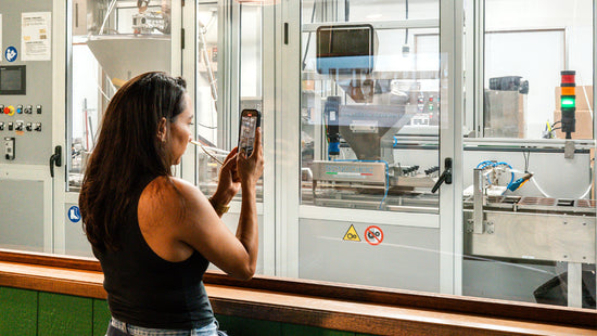 image of person taking photo of chocolate factory