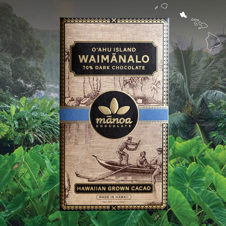 Image of Waimanalo chocolate bar in brown, natural-looking packaging, over tropical forest background