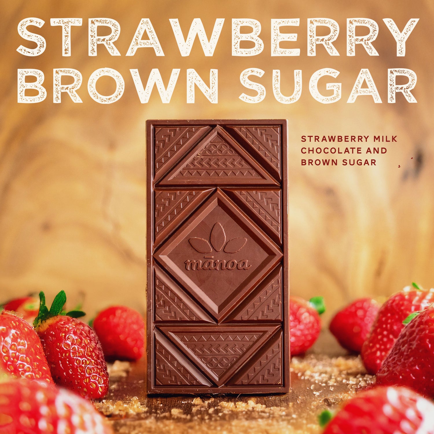 photo of strawberry brown sugar chocolate bar on wood table with strawberries and brown sugar. Text over image says "strawberry brown sugar - strawberry milk chocolate and brown sugar"
