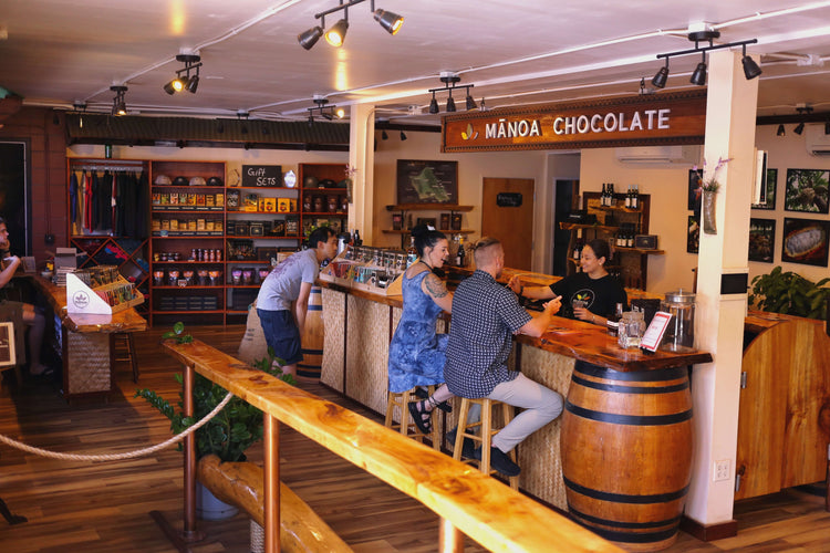 Image of people shopping and enjoying a chocolate tasting