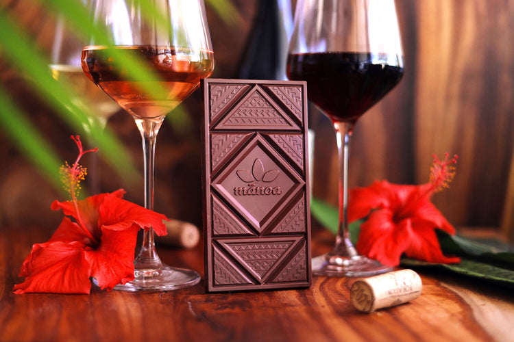 Image of two glasses of wine and a chocolate bar