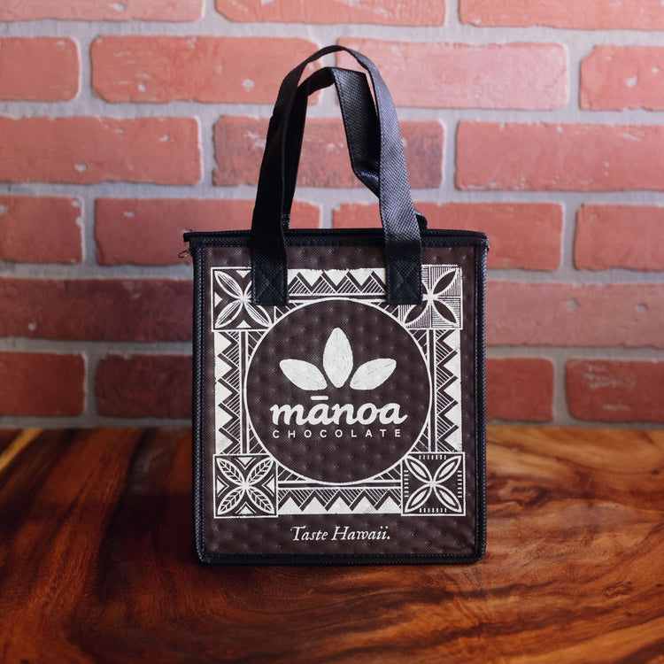 Image of brown insulated bag with white Manoa logo and decorative print