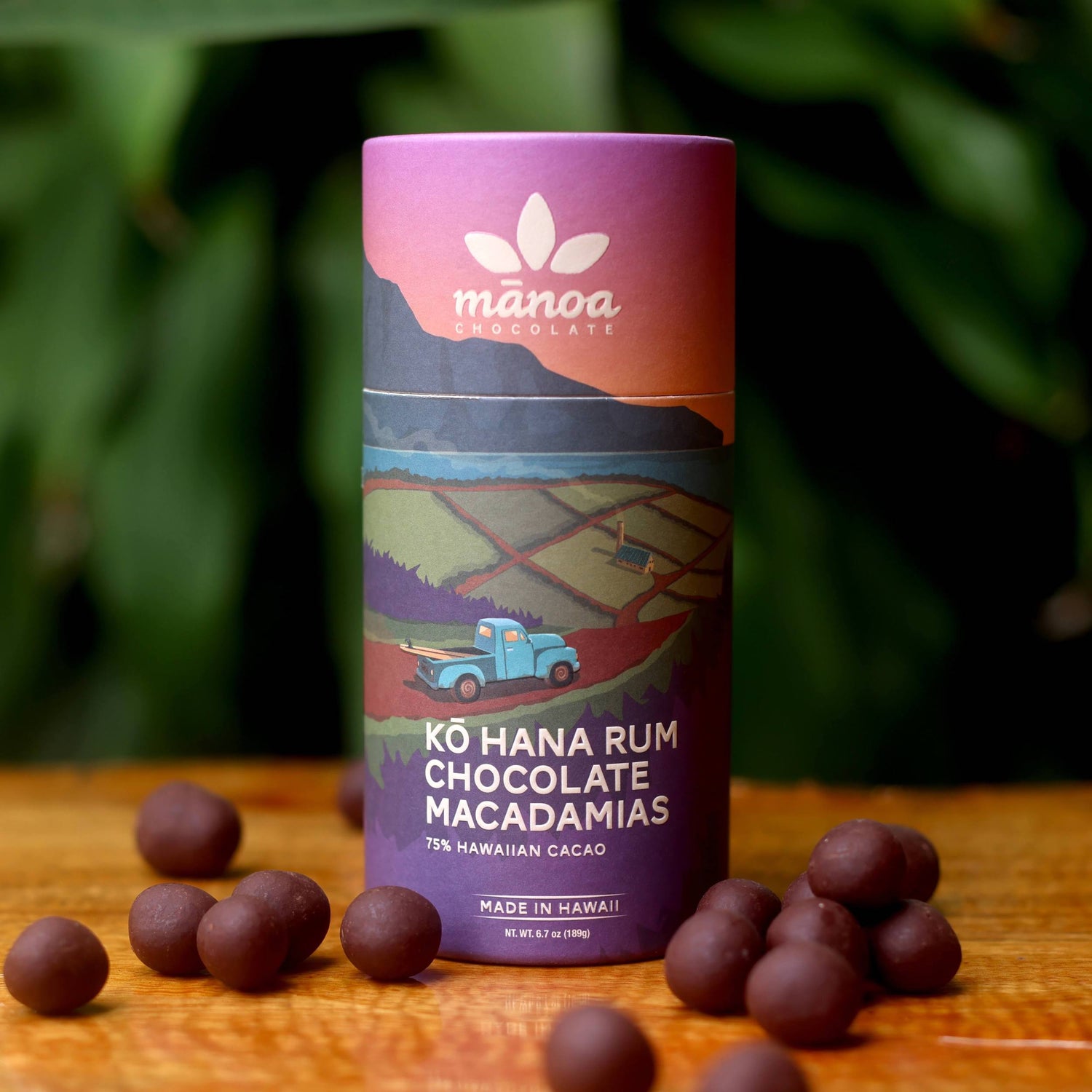 Image of purple tube of Kohana rum chocolate macadamias