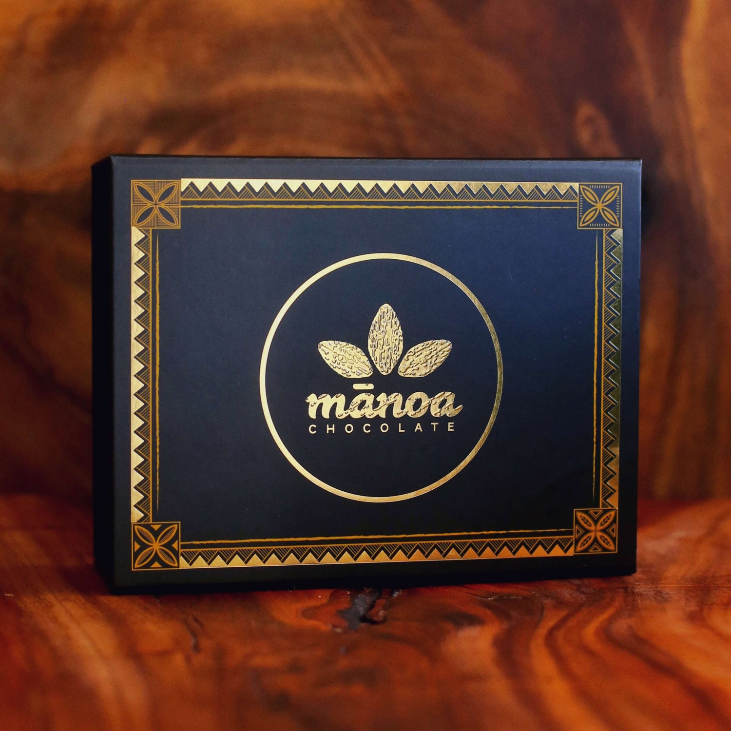 Image of gift box of chocolate with gold Manoa logo