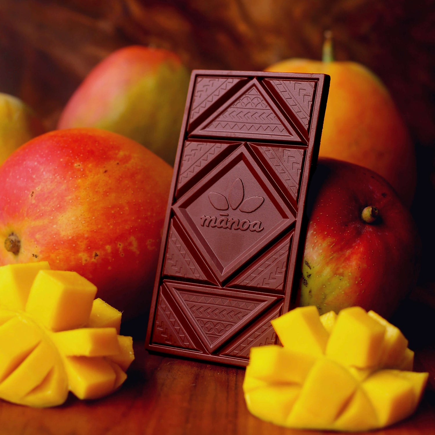 Image of chocolate bar sitting among mangos