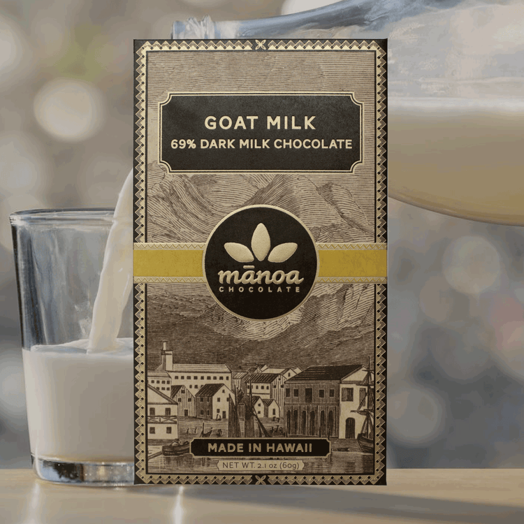 Image of Goat milk chocolate bar, in brown, natural-looking packaging, with a glass of milk