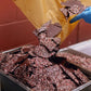 Image of peppermint bark being poured into industrial tray