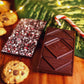 Image showing the front and back of peppermint crunch bar, with candy cane pieces on one side and Manoa Chocolate logo on the other